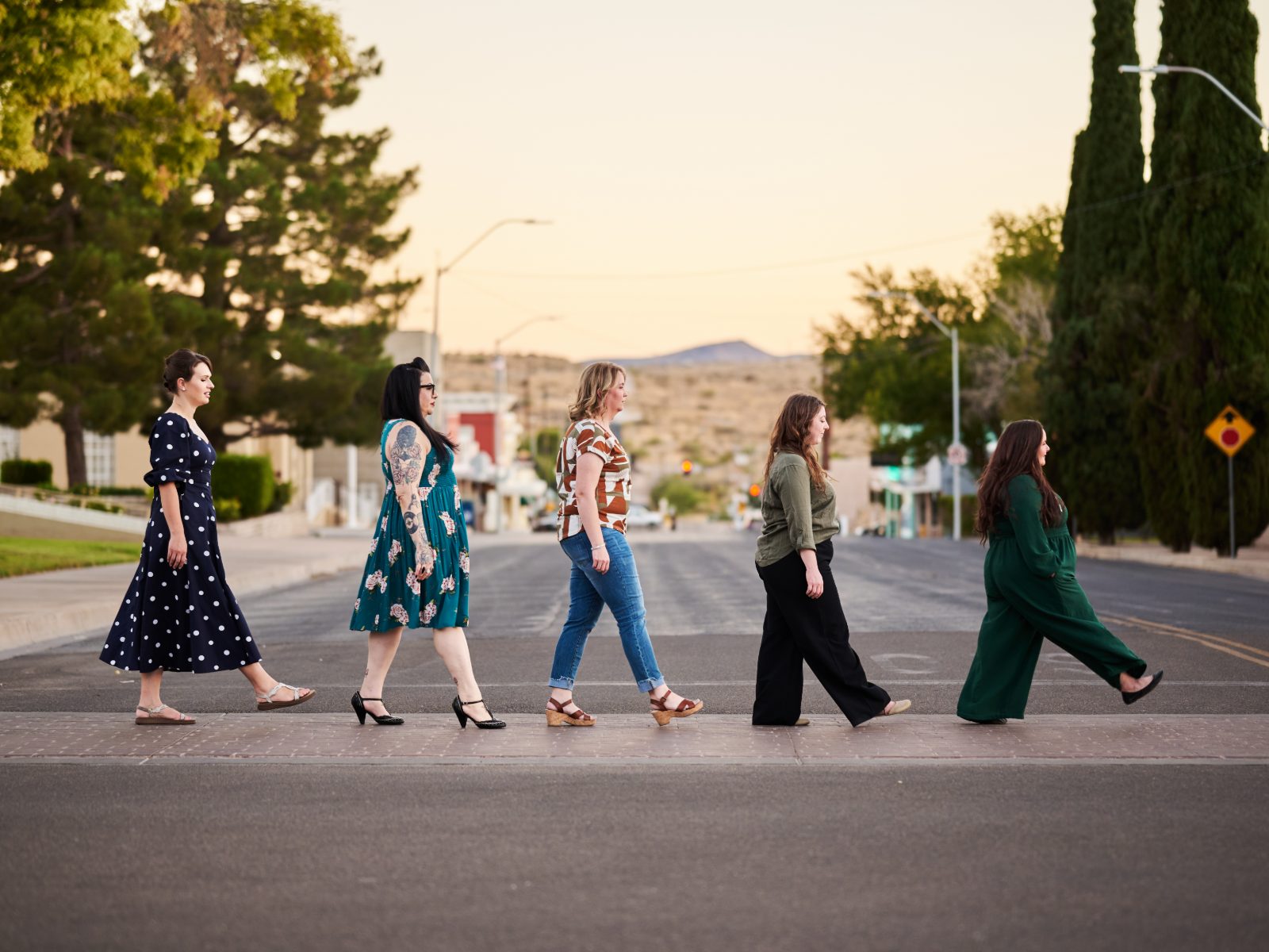 The Liberating Love team crossing the street in a line